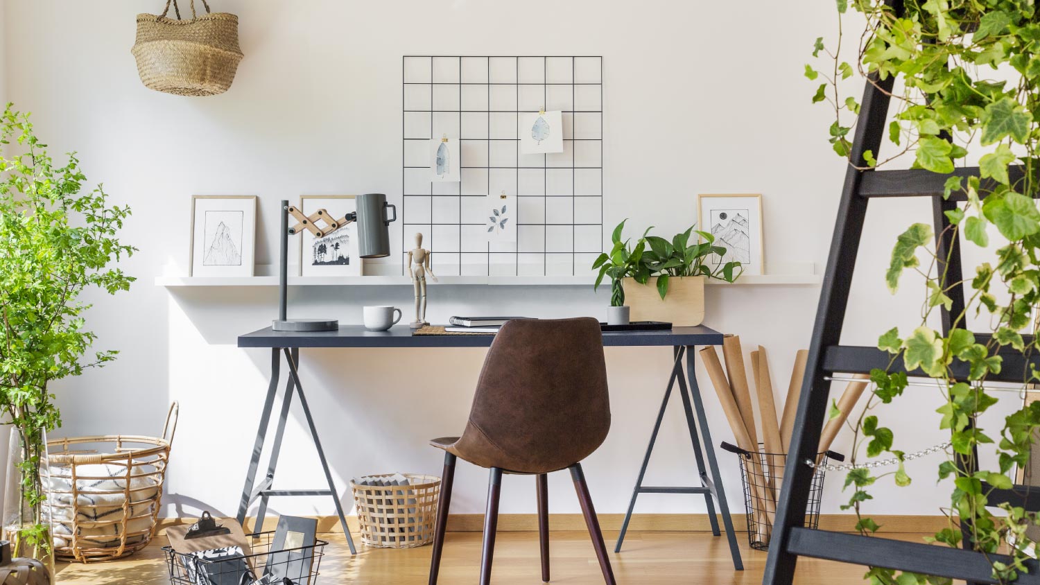 Brown chair at desk in white boho home office interior