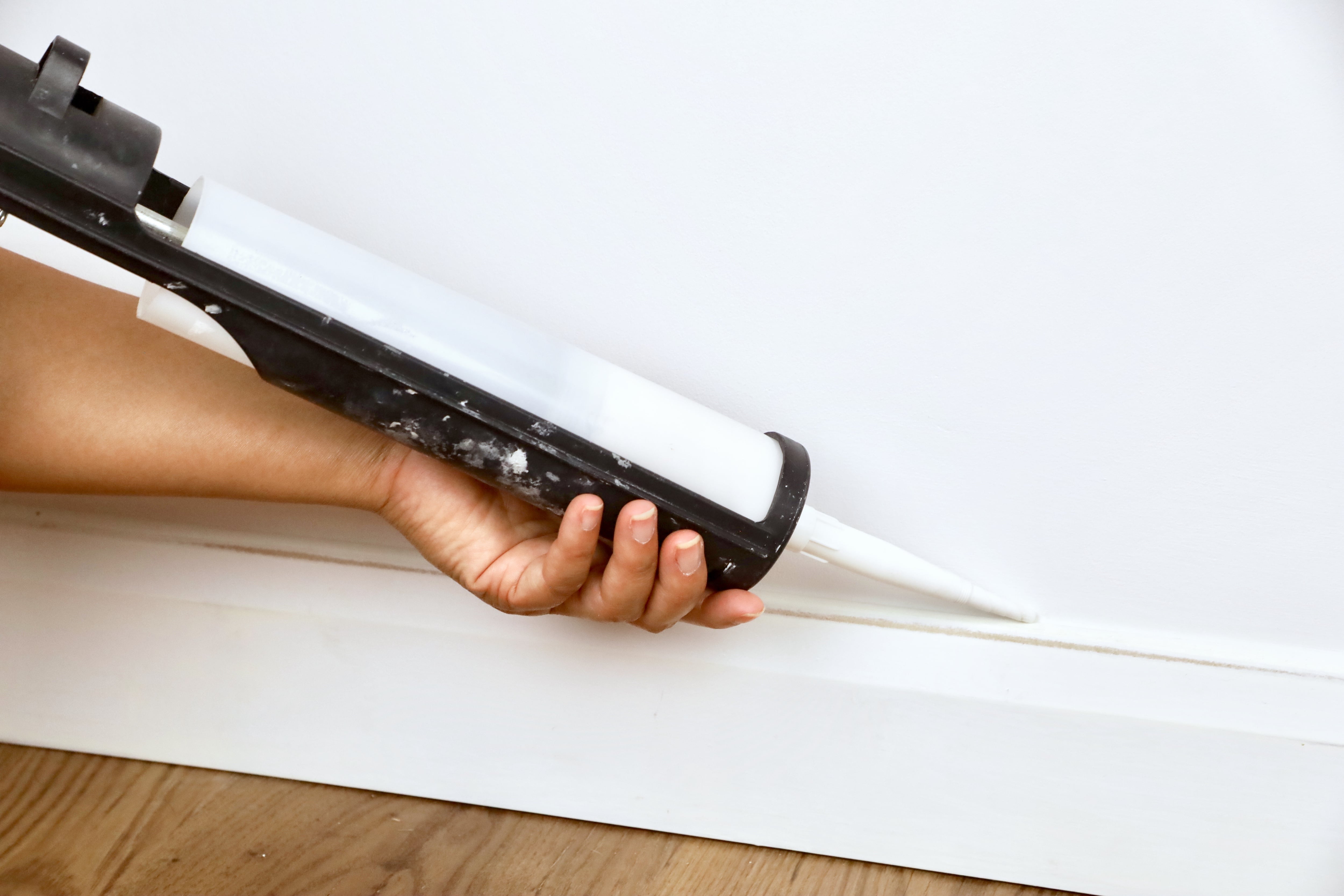 Caulking top edge of baseboard