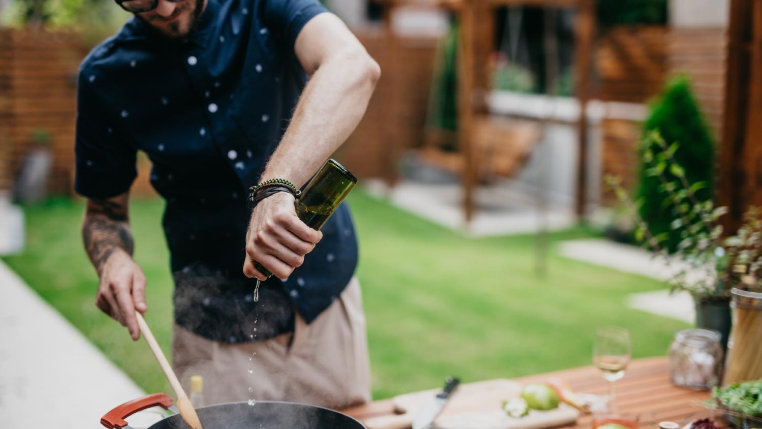 Chef putting wine in a dish