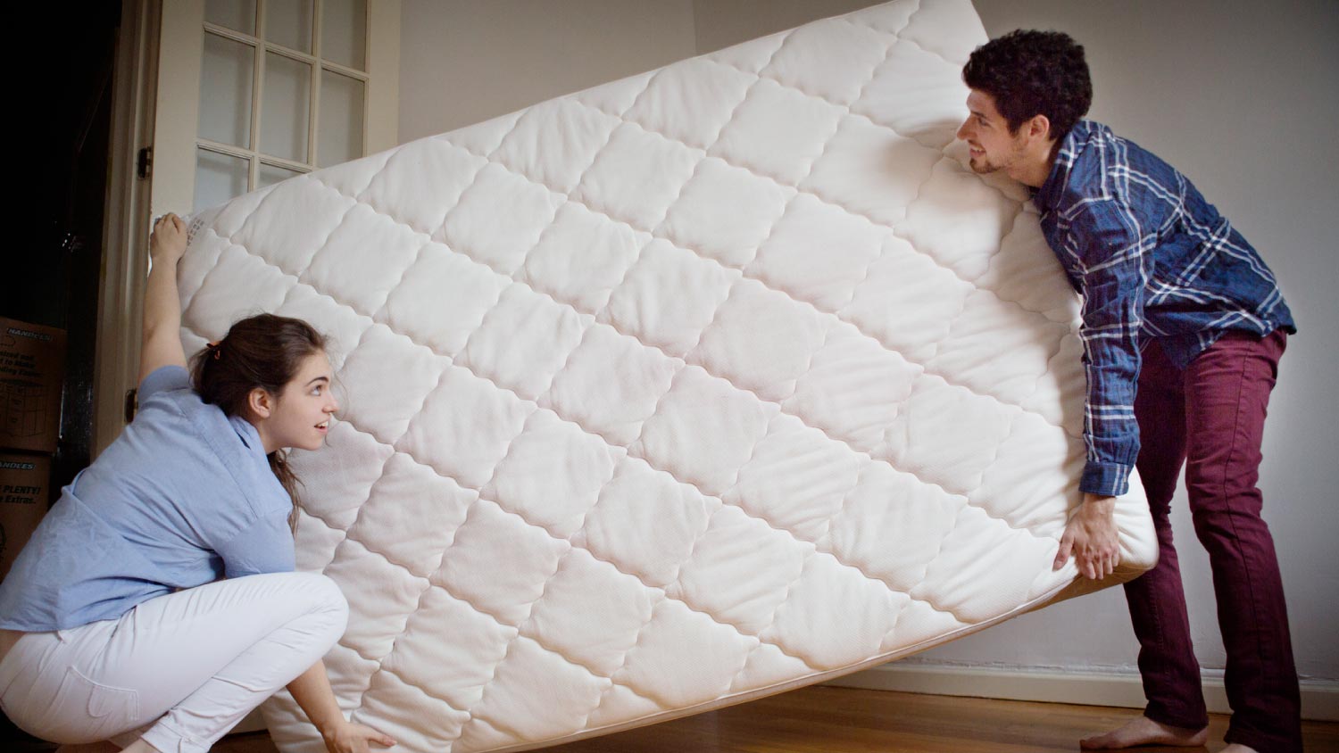 https://s3media.angieslist.com/s3fs-public/Couple-carrying-mattress-room-.jpeg?impolicy=leadImage