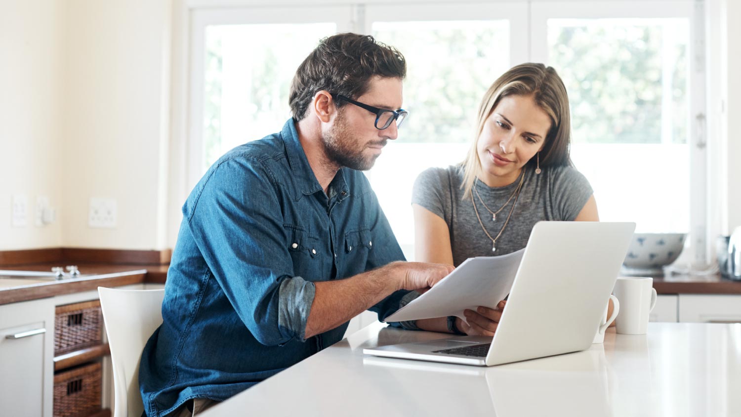 A couple reviewing their furniture warranty