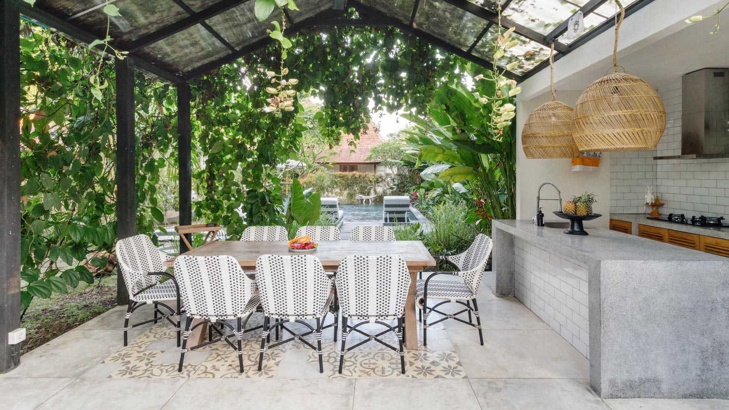 A dining room table and chairs on open kitchen