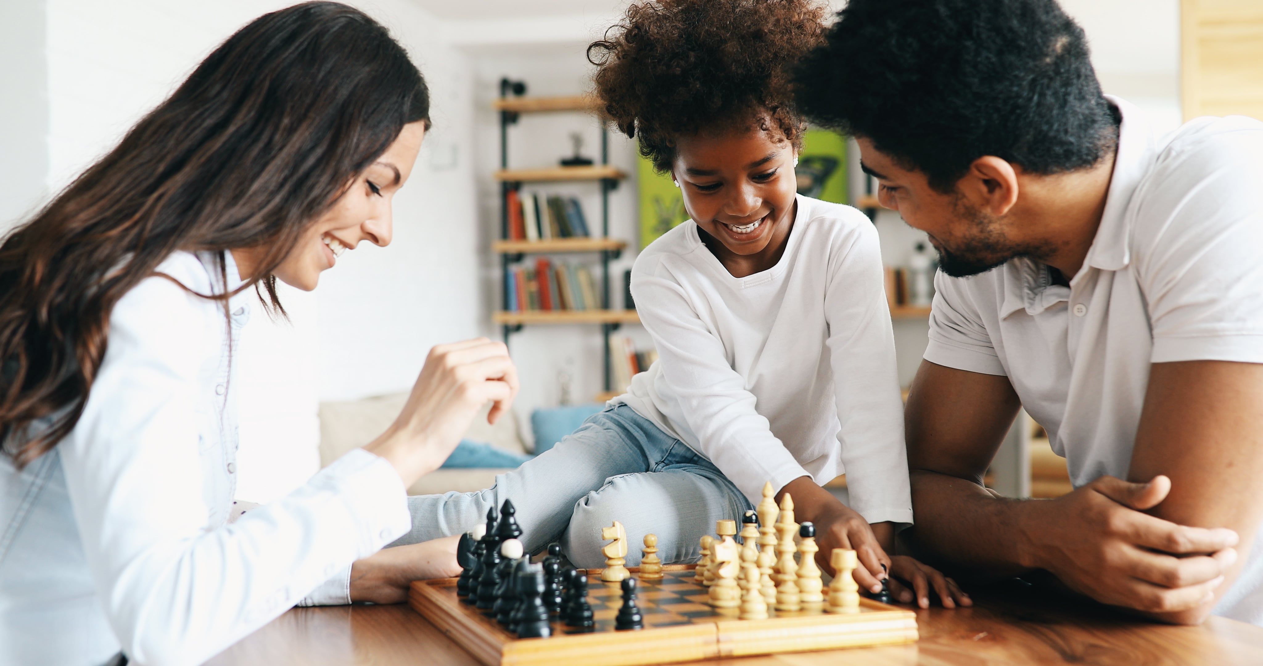 Family playing chess game