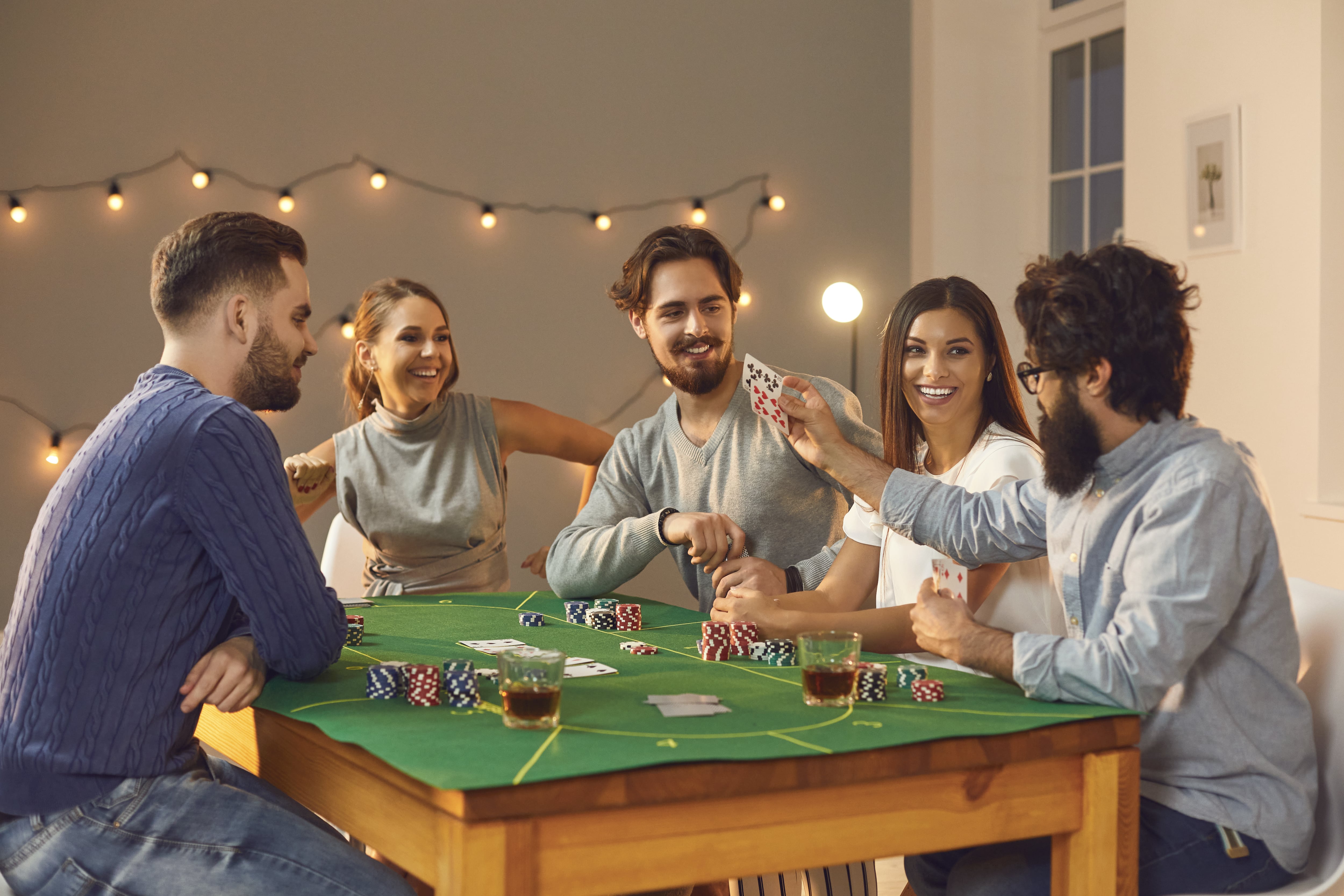 Friends playing poker at home