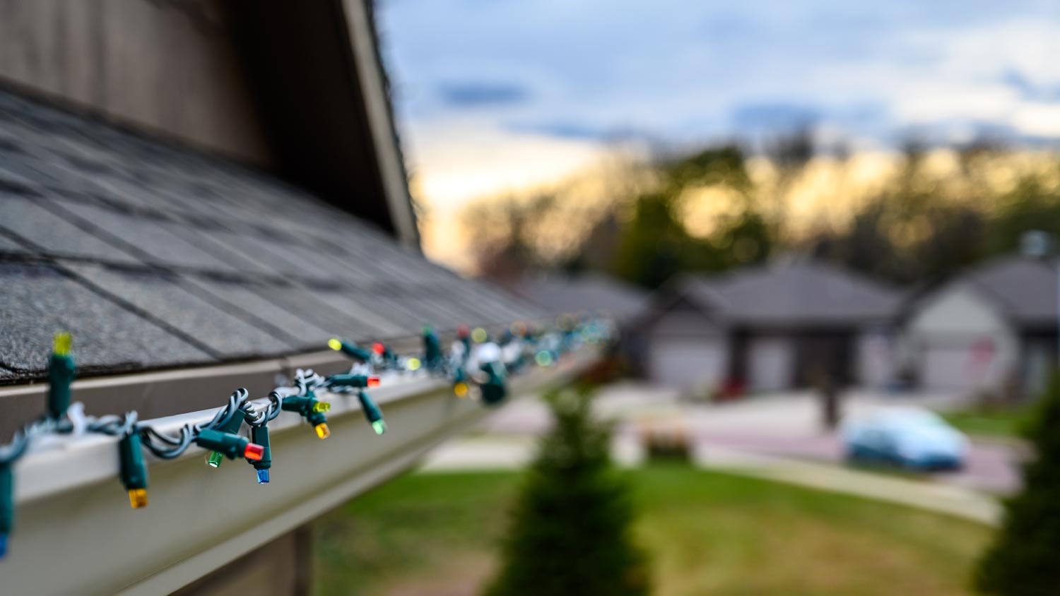 Hanging Christmas lights on gutter edge