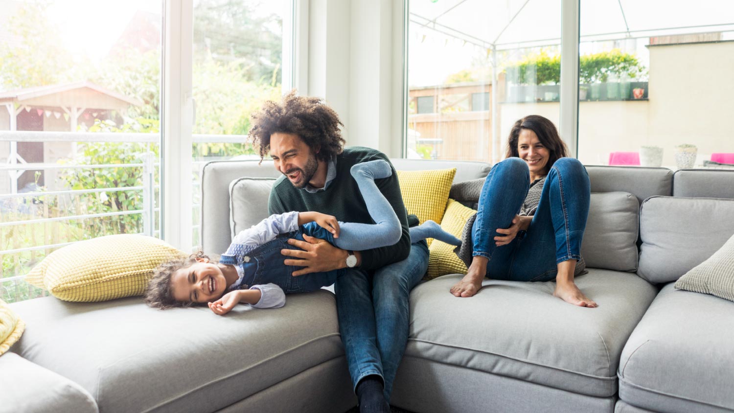 Happy family sitting on couch