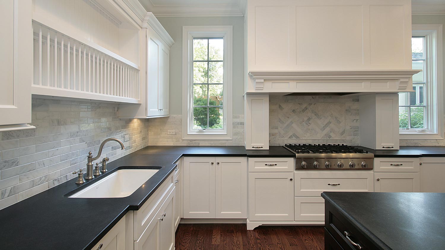 Kitchen with black countertops