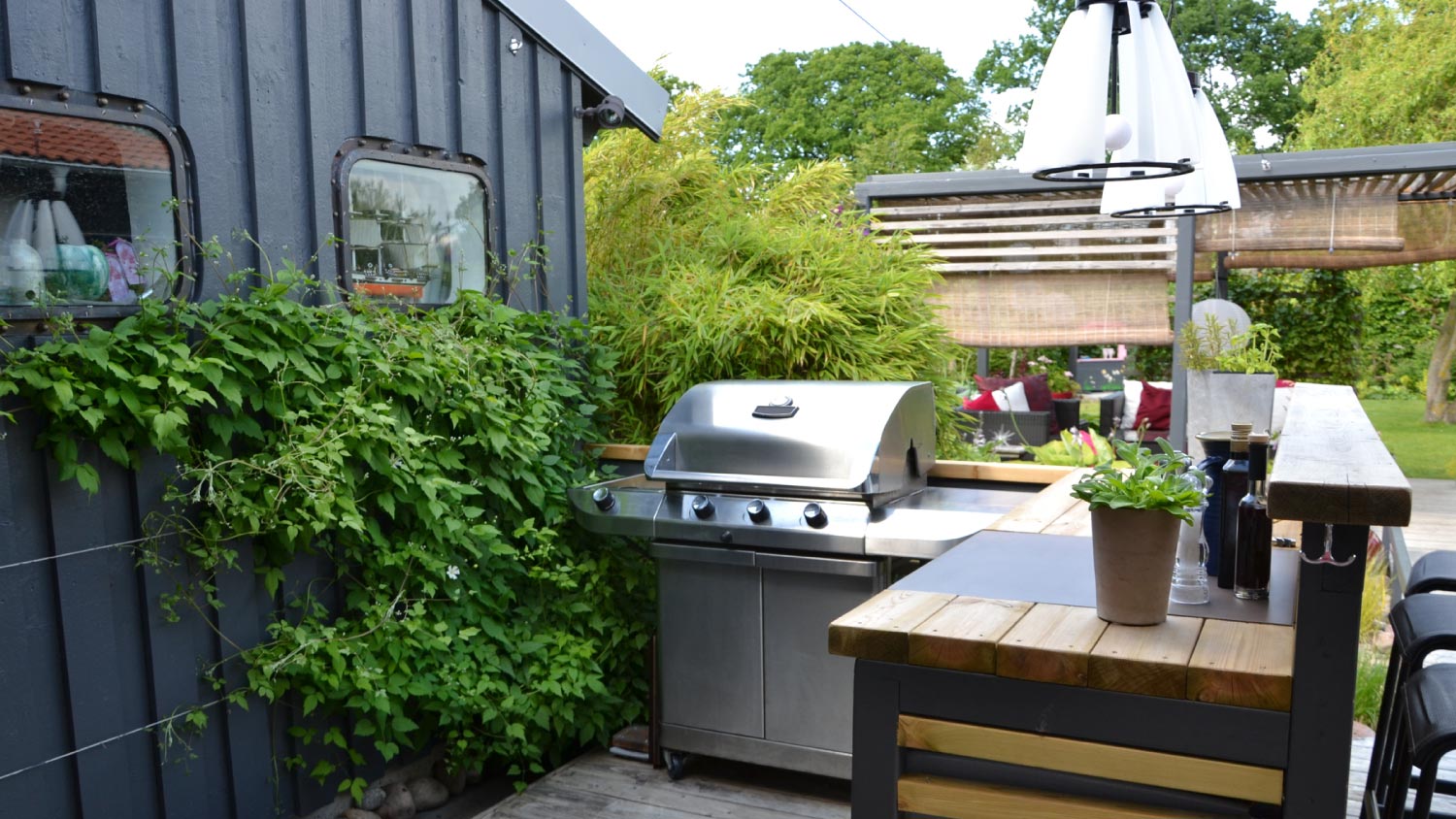 Outdoor kitchen with a stainless gas grill