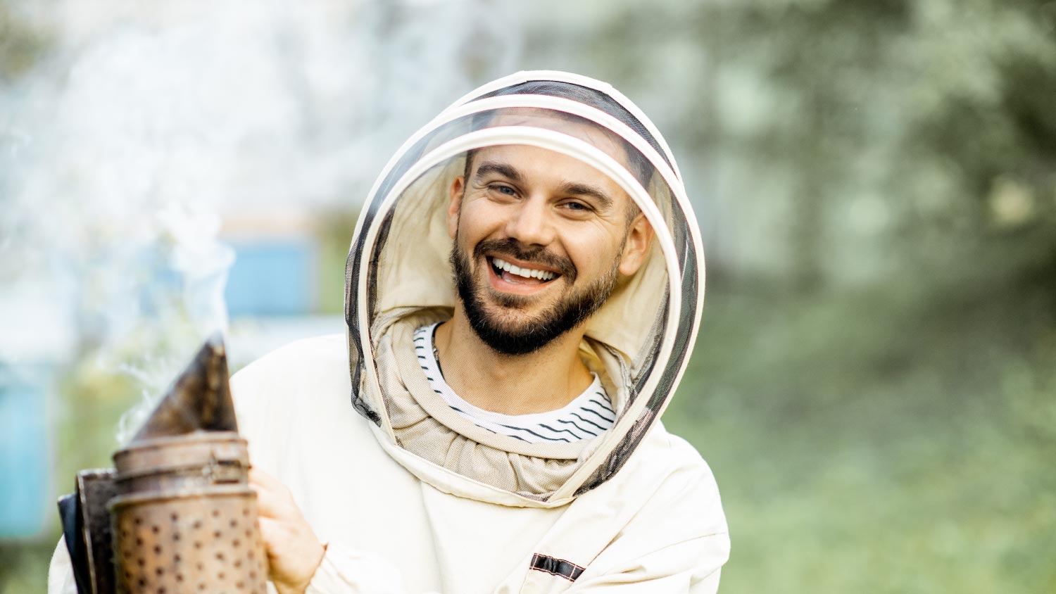 Portrait of a cheerful beekeeper