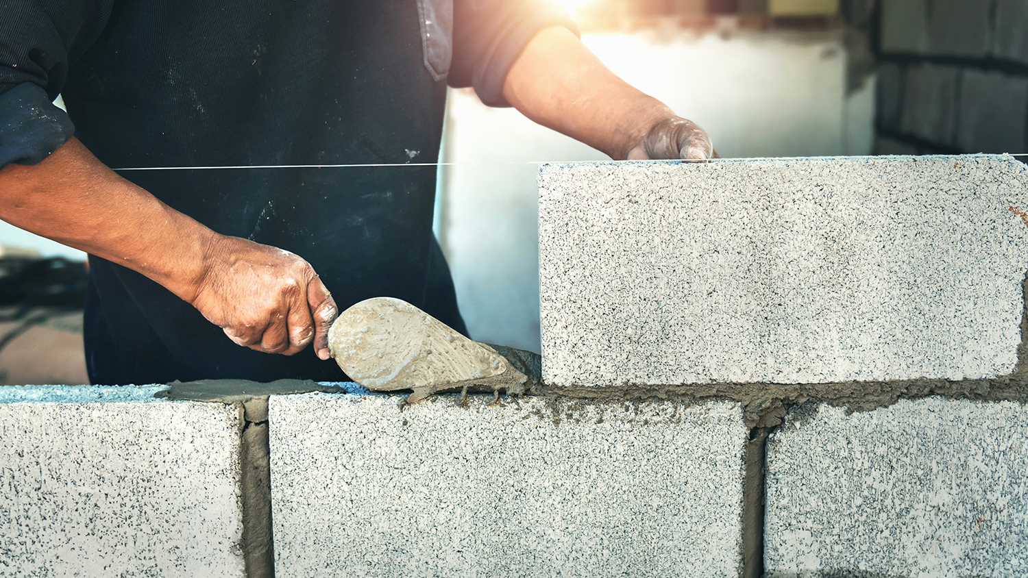 Professional laying bricks with cement