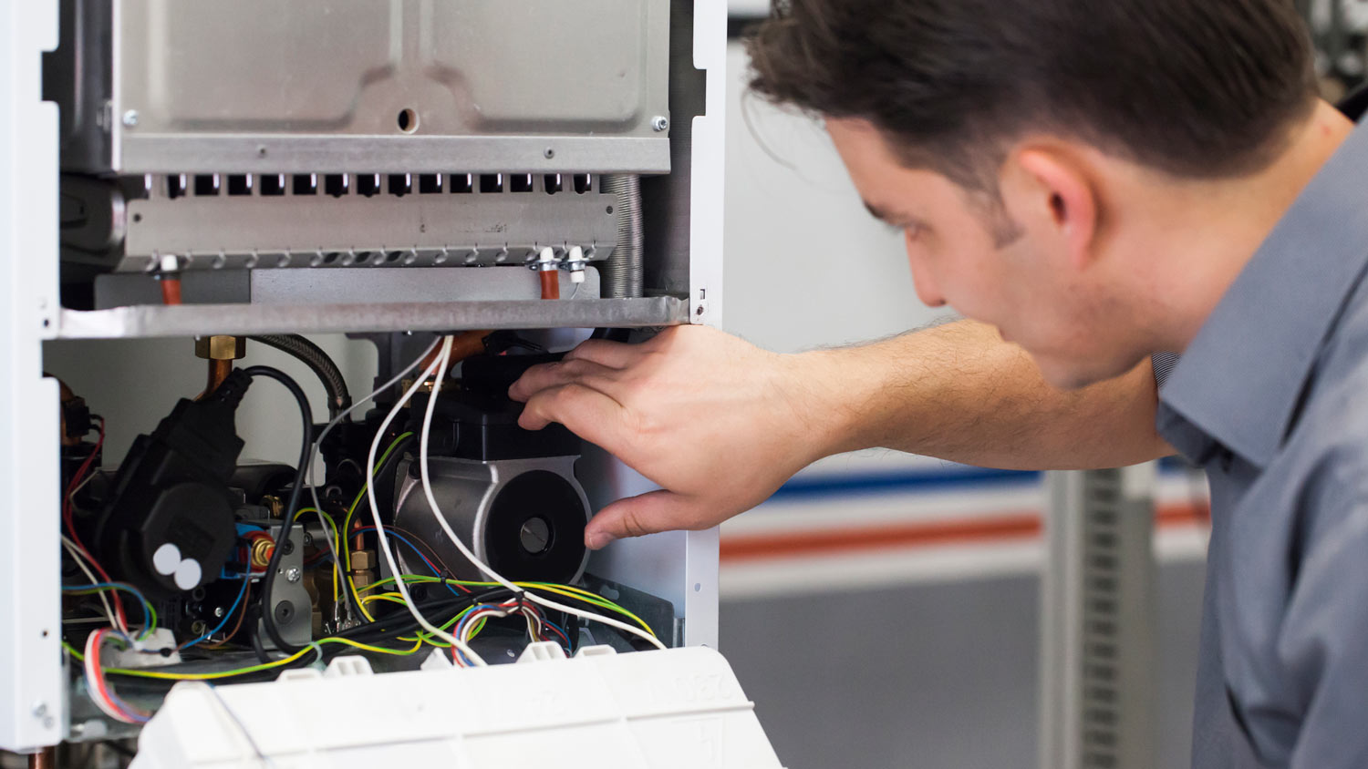 A technician inspecting a furnace