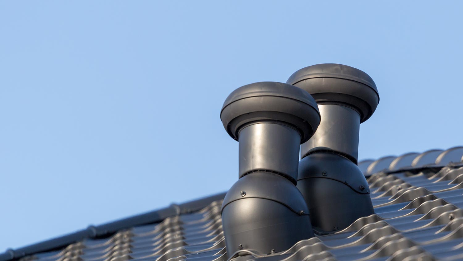 Ventilation chimneys on roof of a house