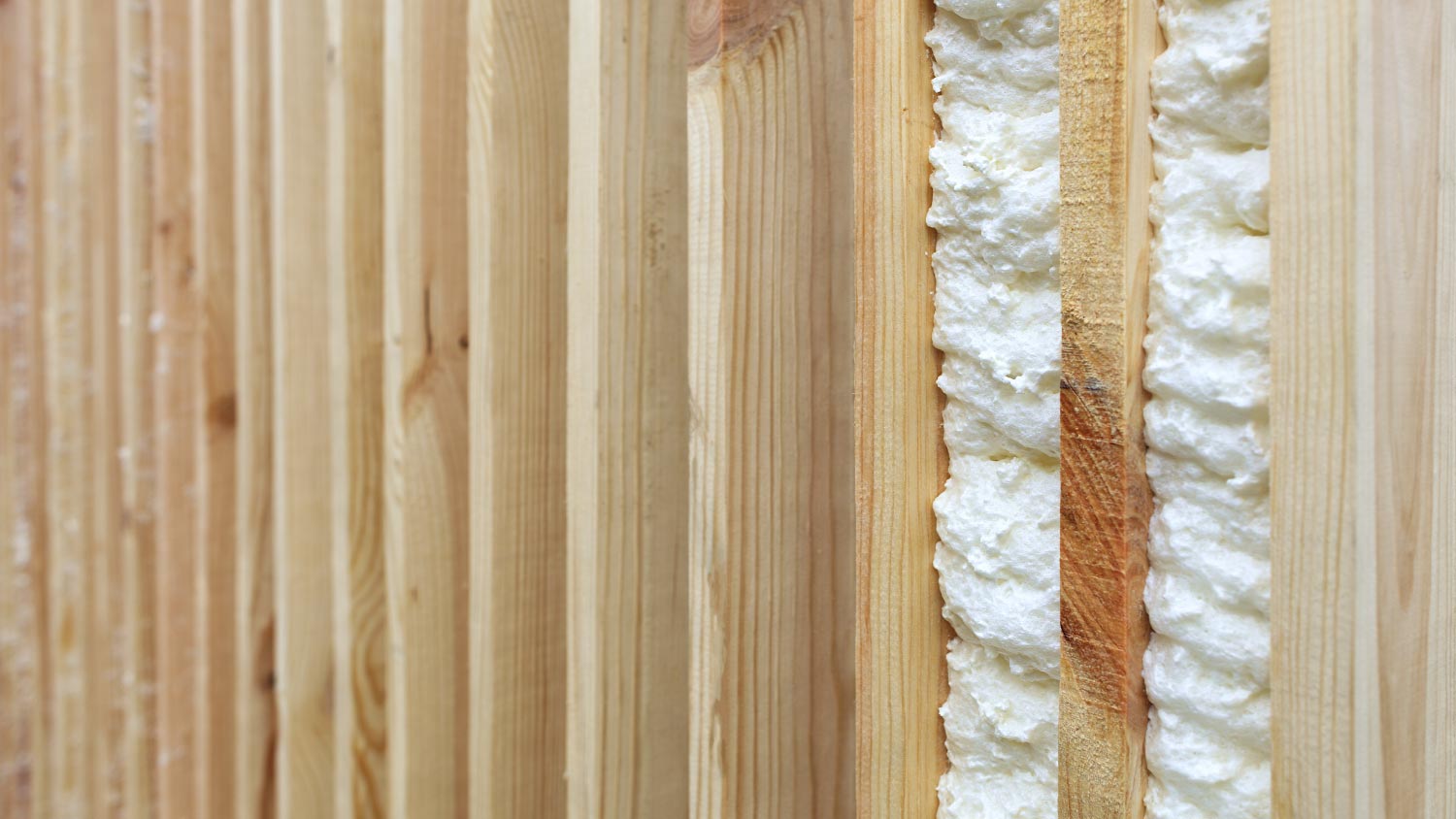 Vertical wooden planks with building foam