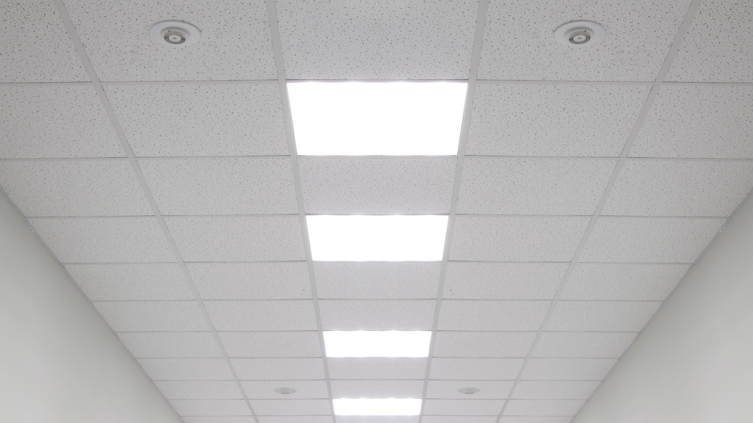 A close up of a white drop ceiling 