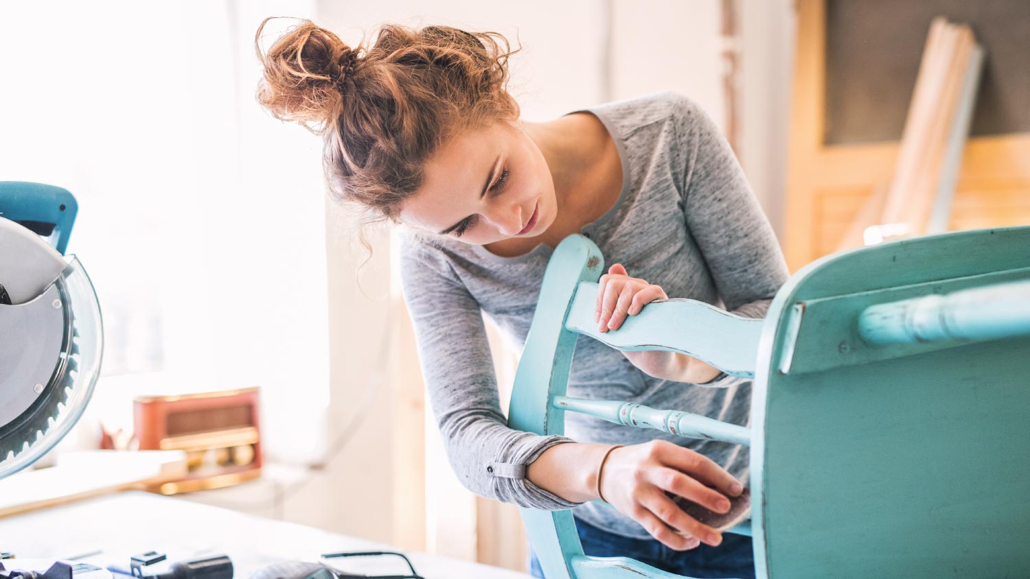 Woman painting a chair