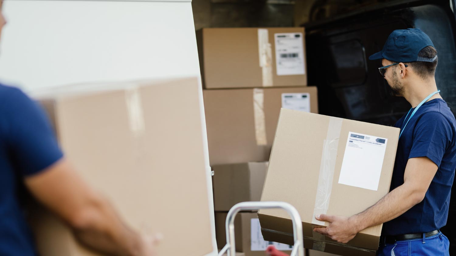 Workers preparing packages for shipment