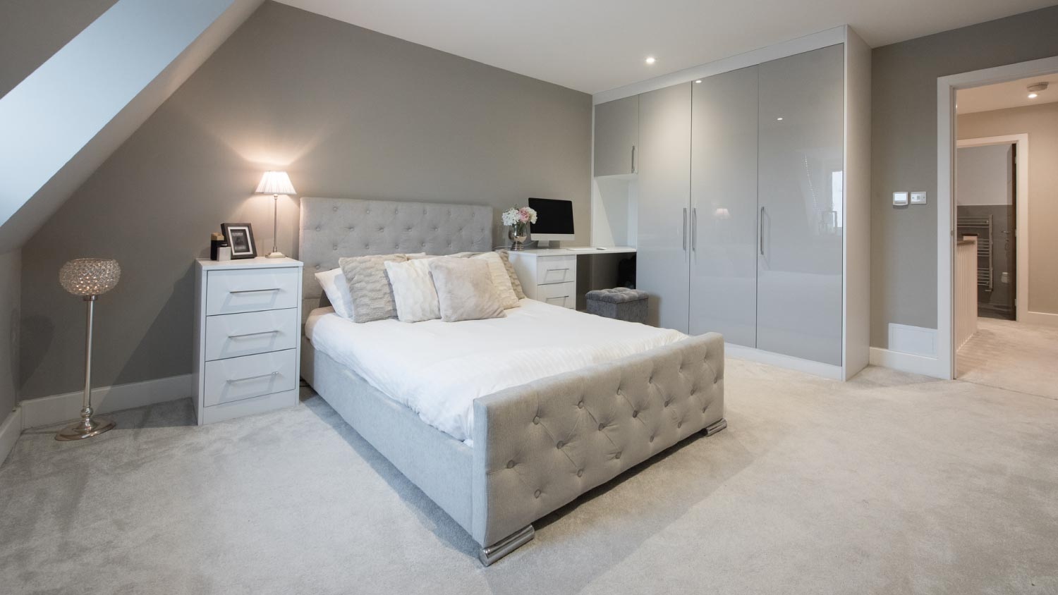 An interior view of a grey coloured double bedroom