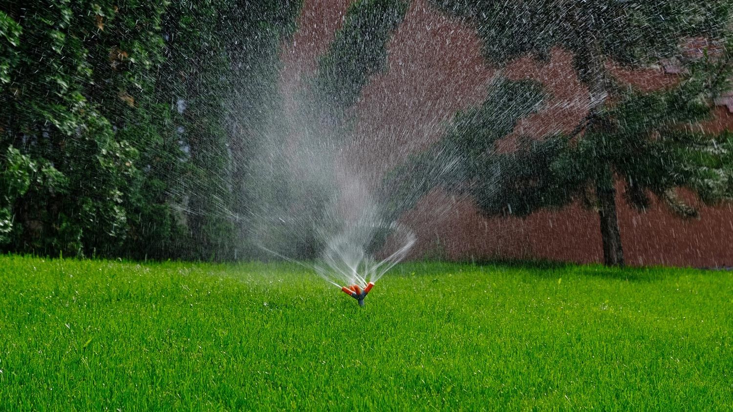 An automatic irrigation system watering the lawn