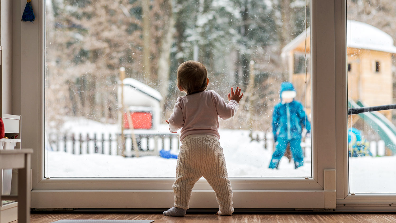 Baby looking at snow