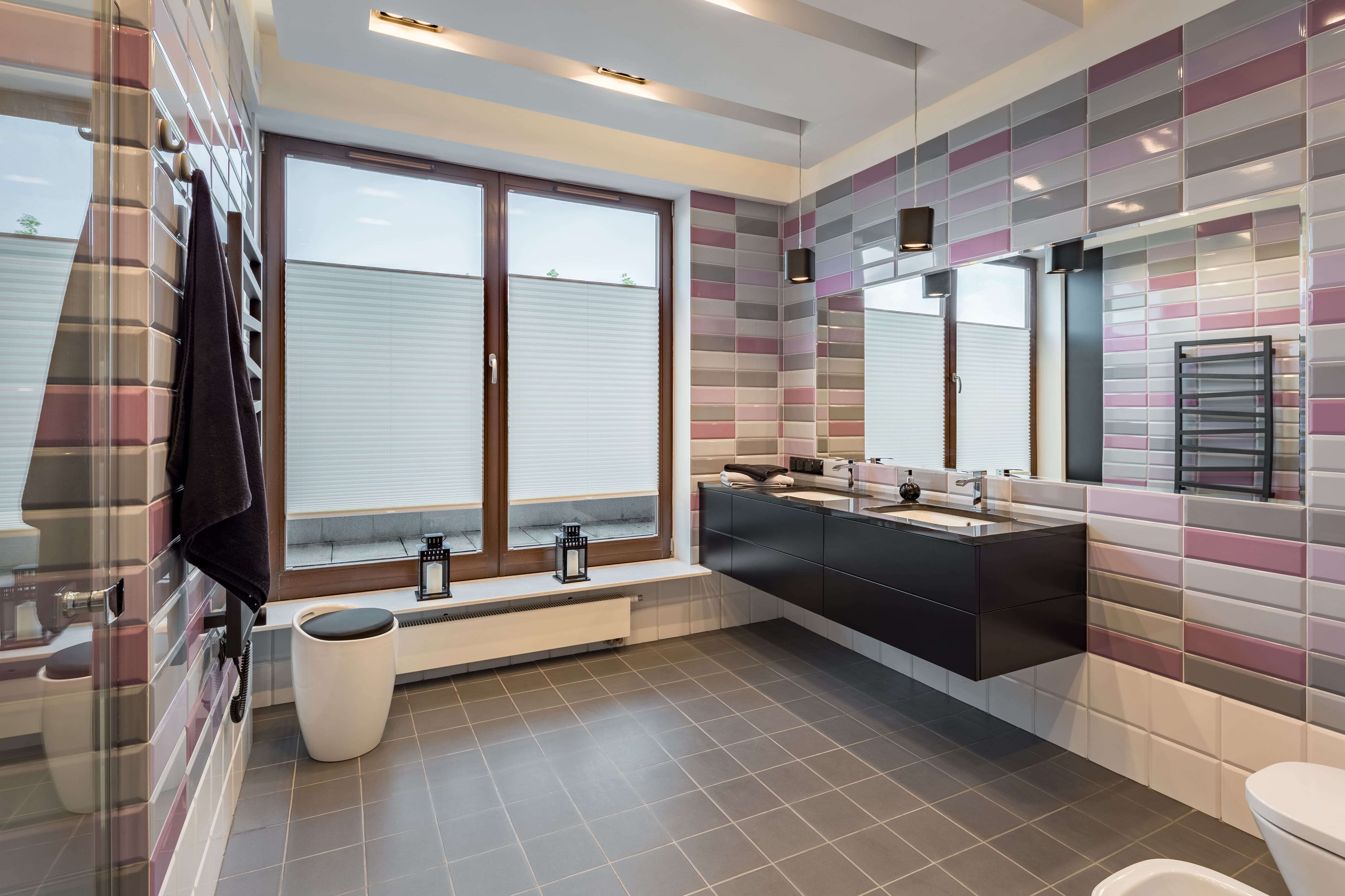 Contemporary bathroom with pink and gray brick tiles