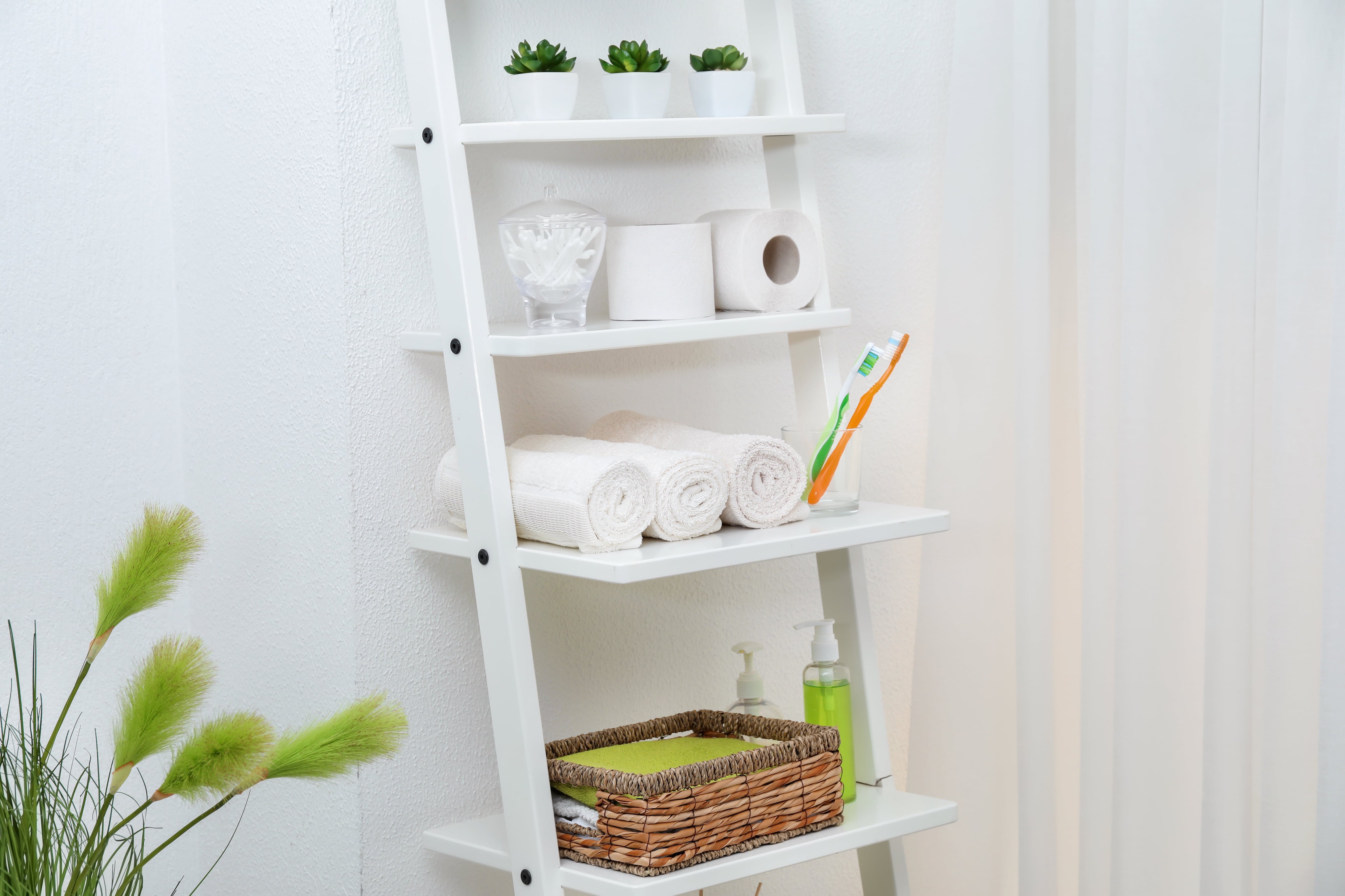 White open shelving unit in bathroom