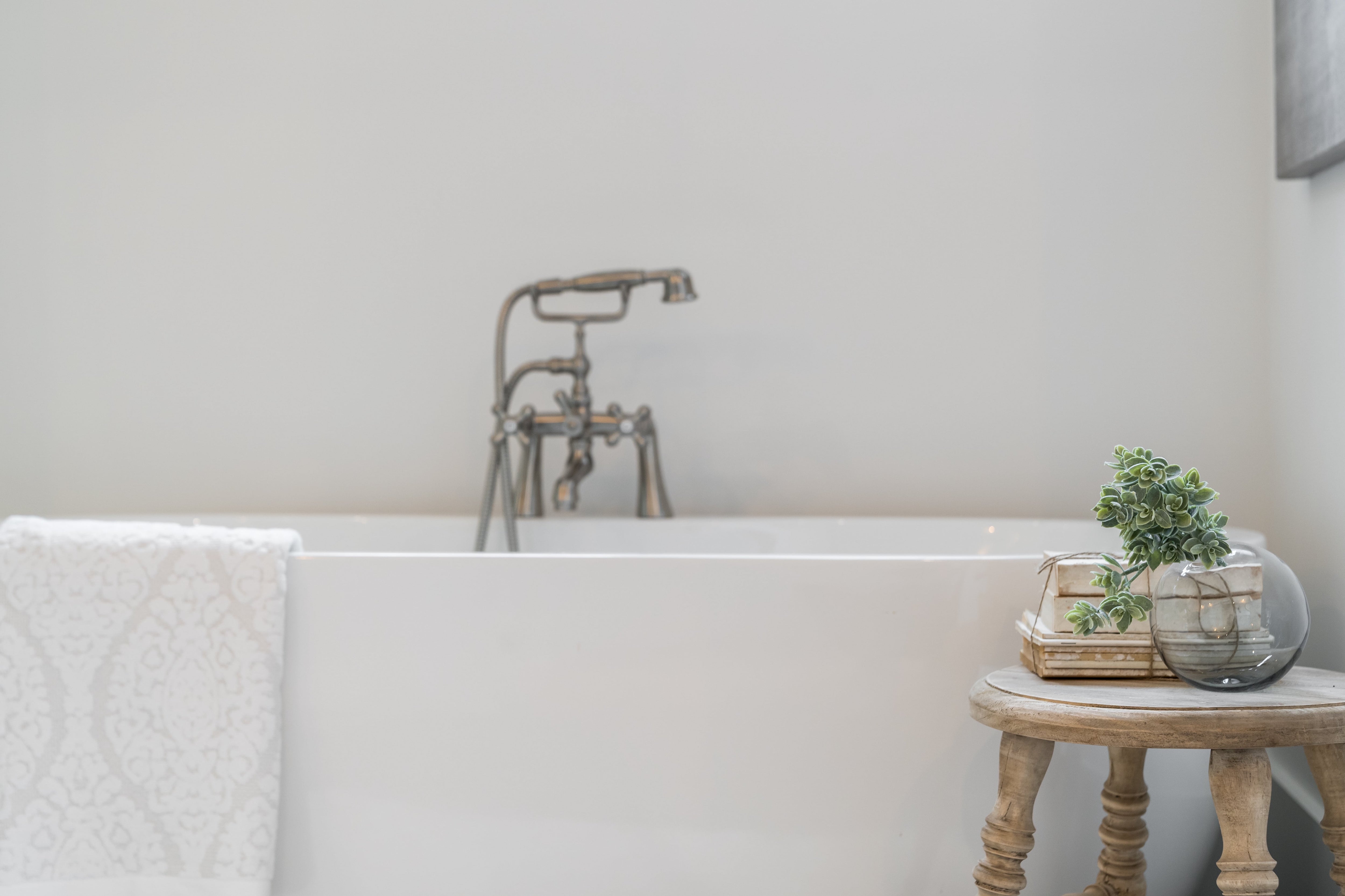 Footstool next to tub in bathroom