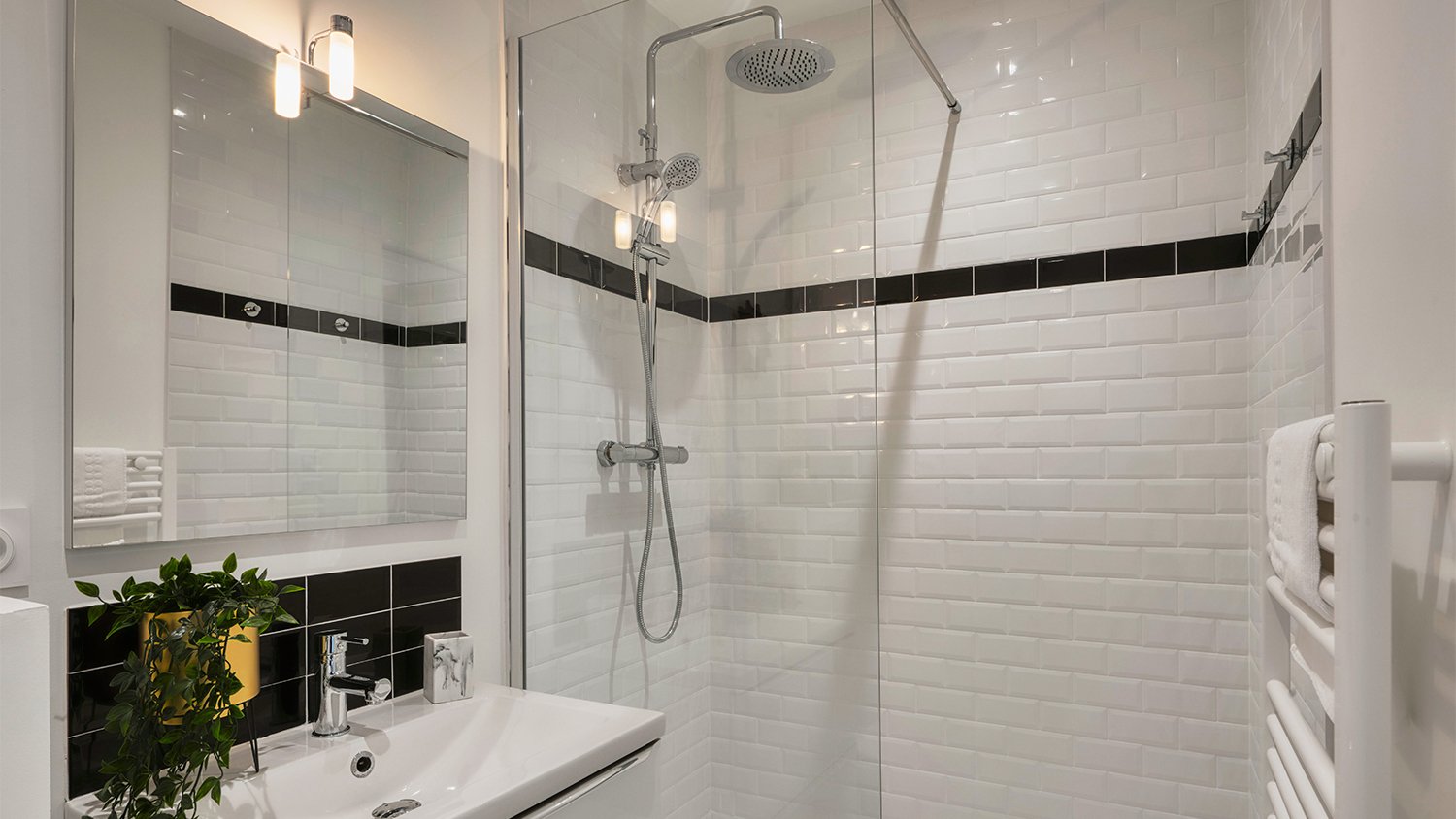 small white bathroom with glass shower