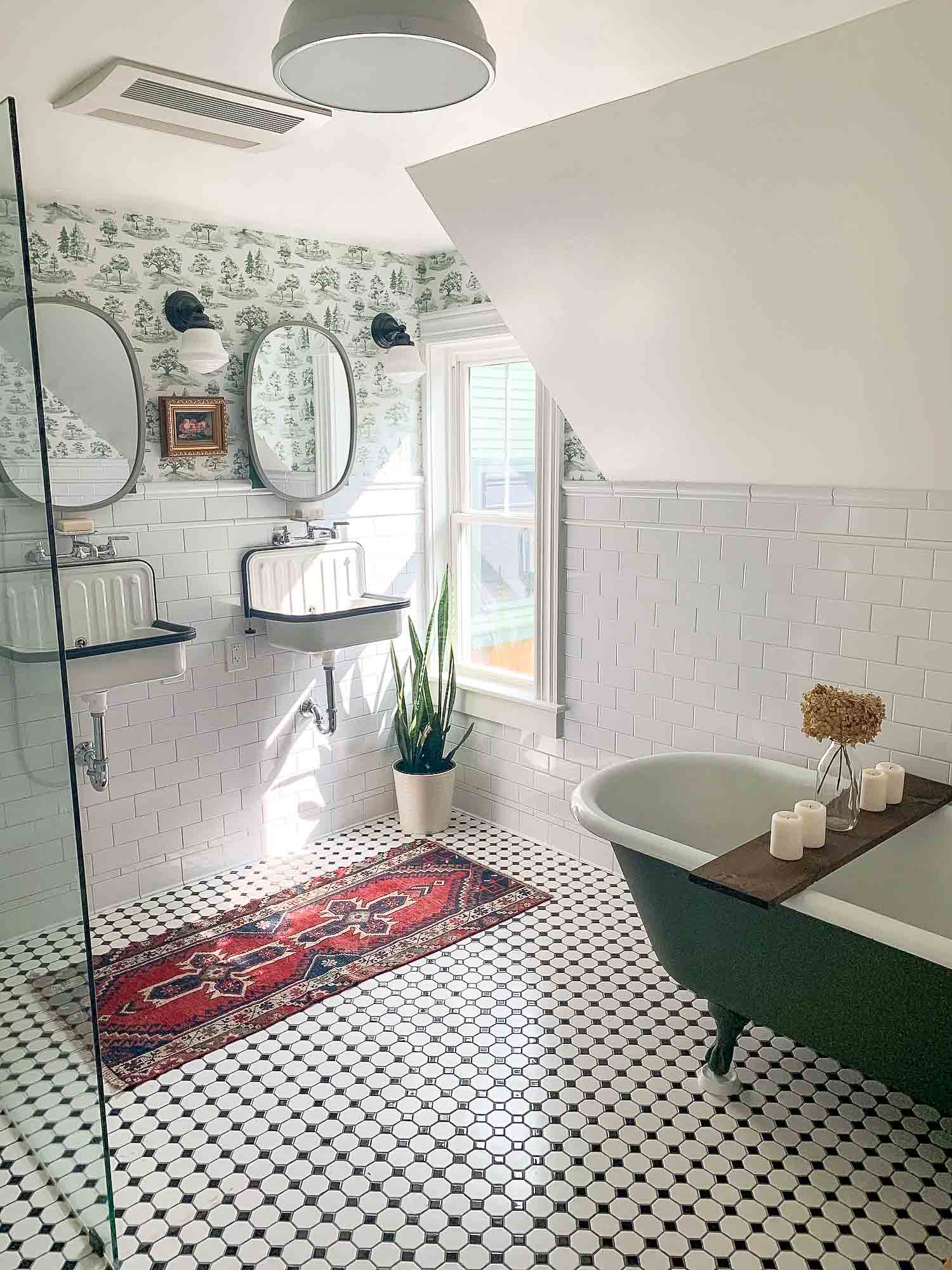 Bathroom green tub black and white tile