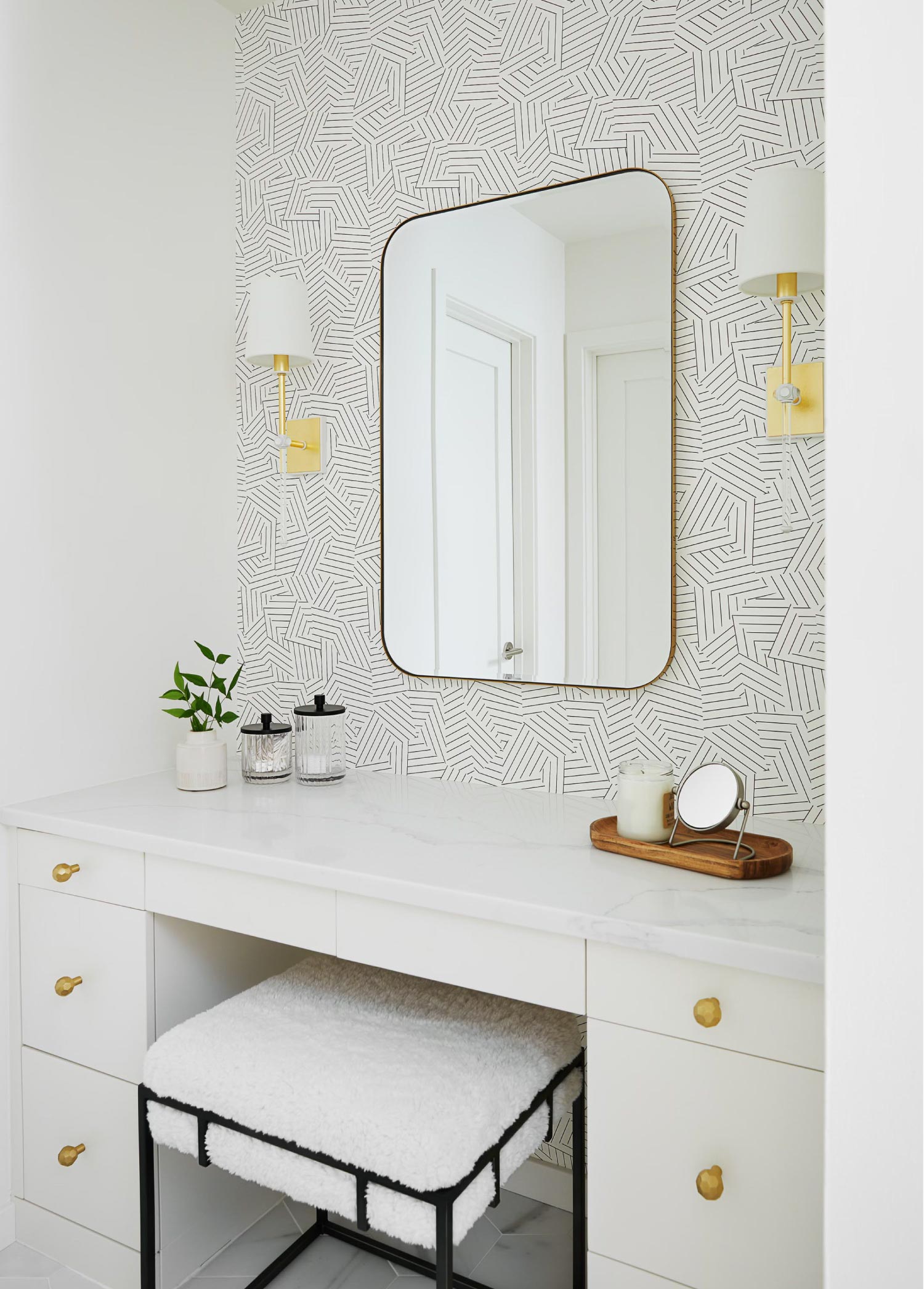 A bathroom with a sit-down vanity