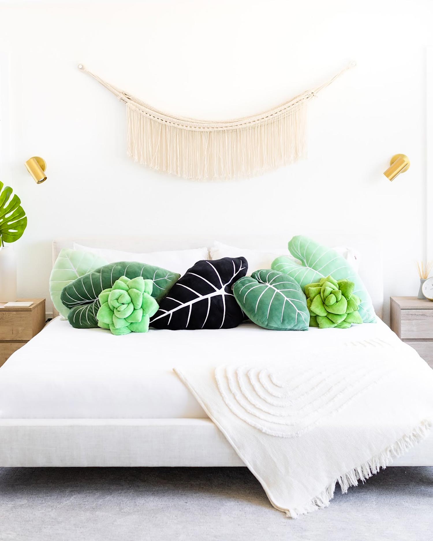 A bedroom with plant inspired accessories