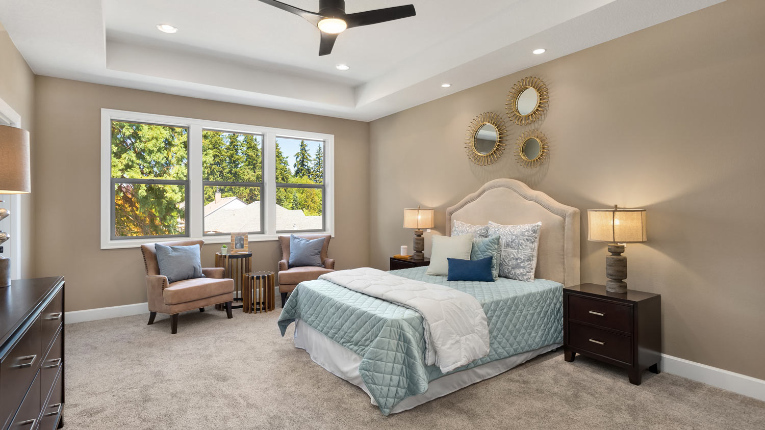 A bedroom with a wall-to-wall carpet