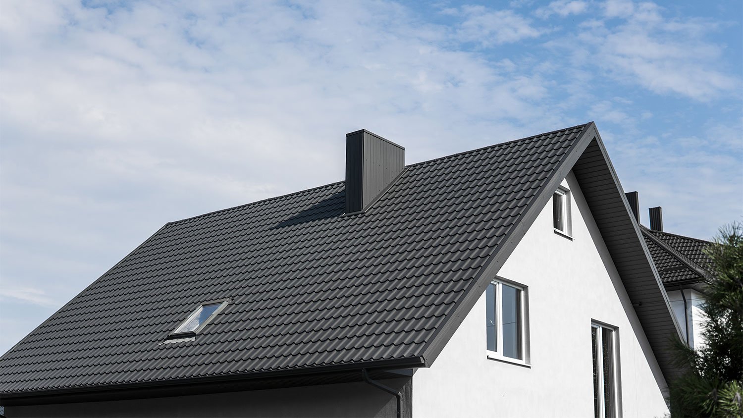 Modern house with black metal roof