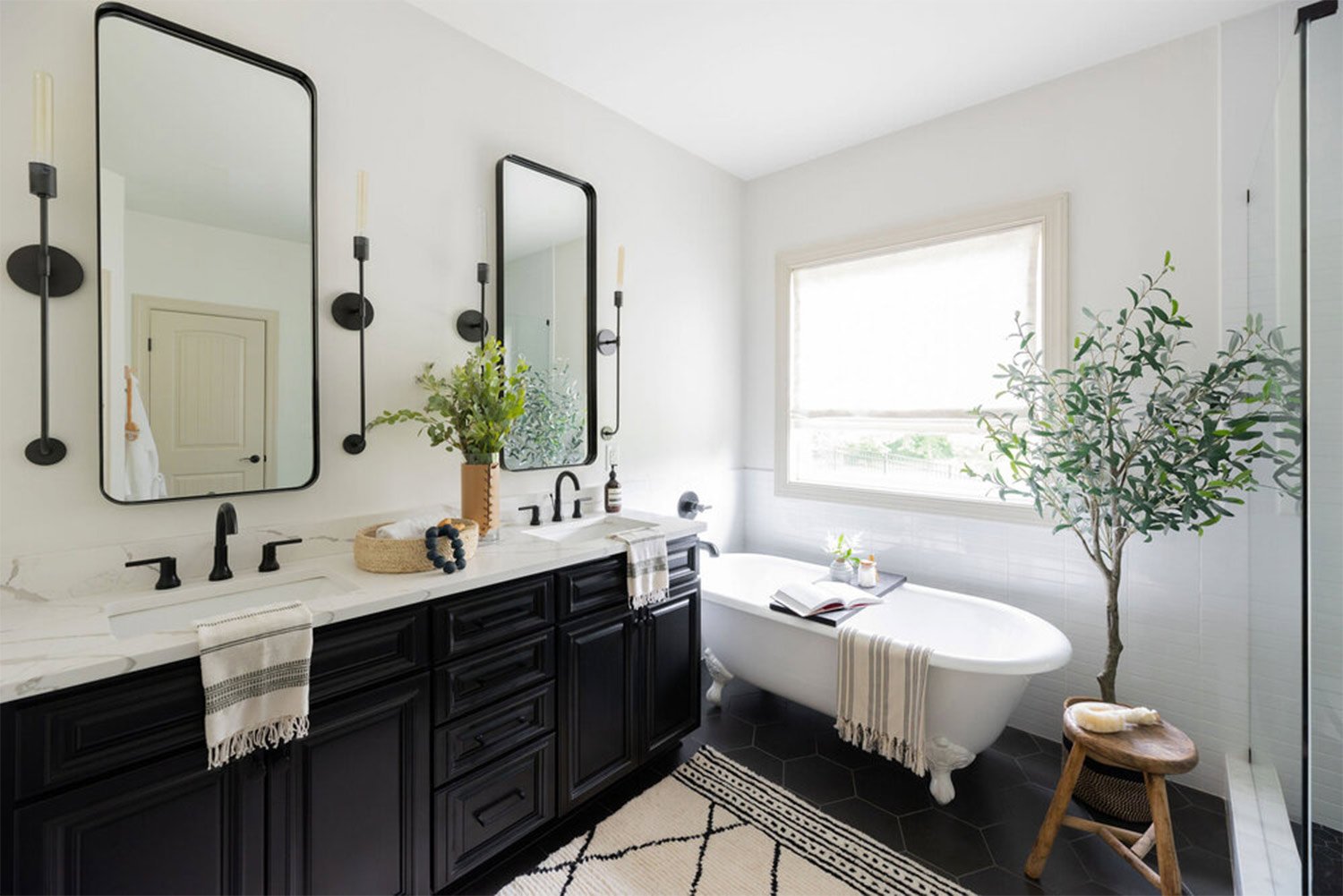 Black and white bathtub and mirrors