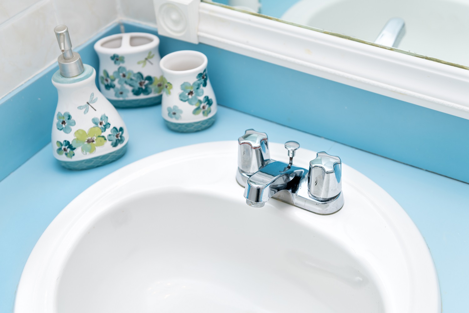 Detail of a painted blue corner vanity