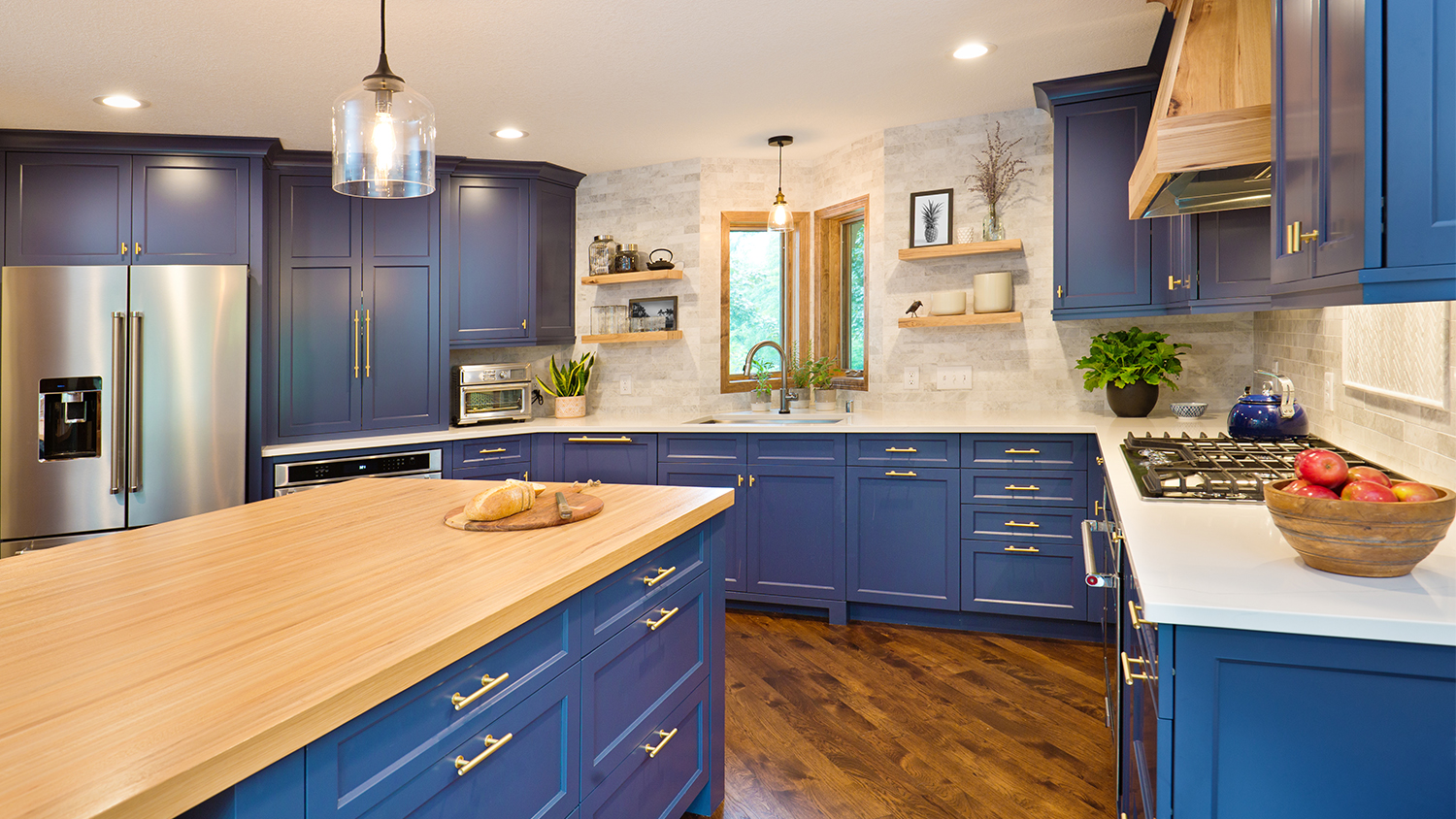 kitchen with blue cabinets and hickory wood floor