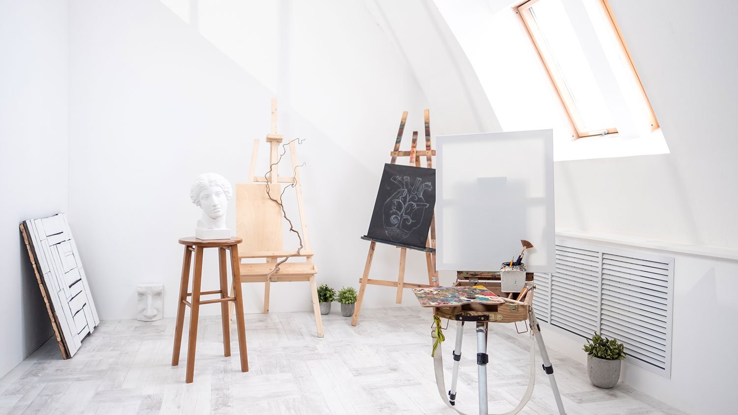 Bright attic studio with easel