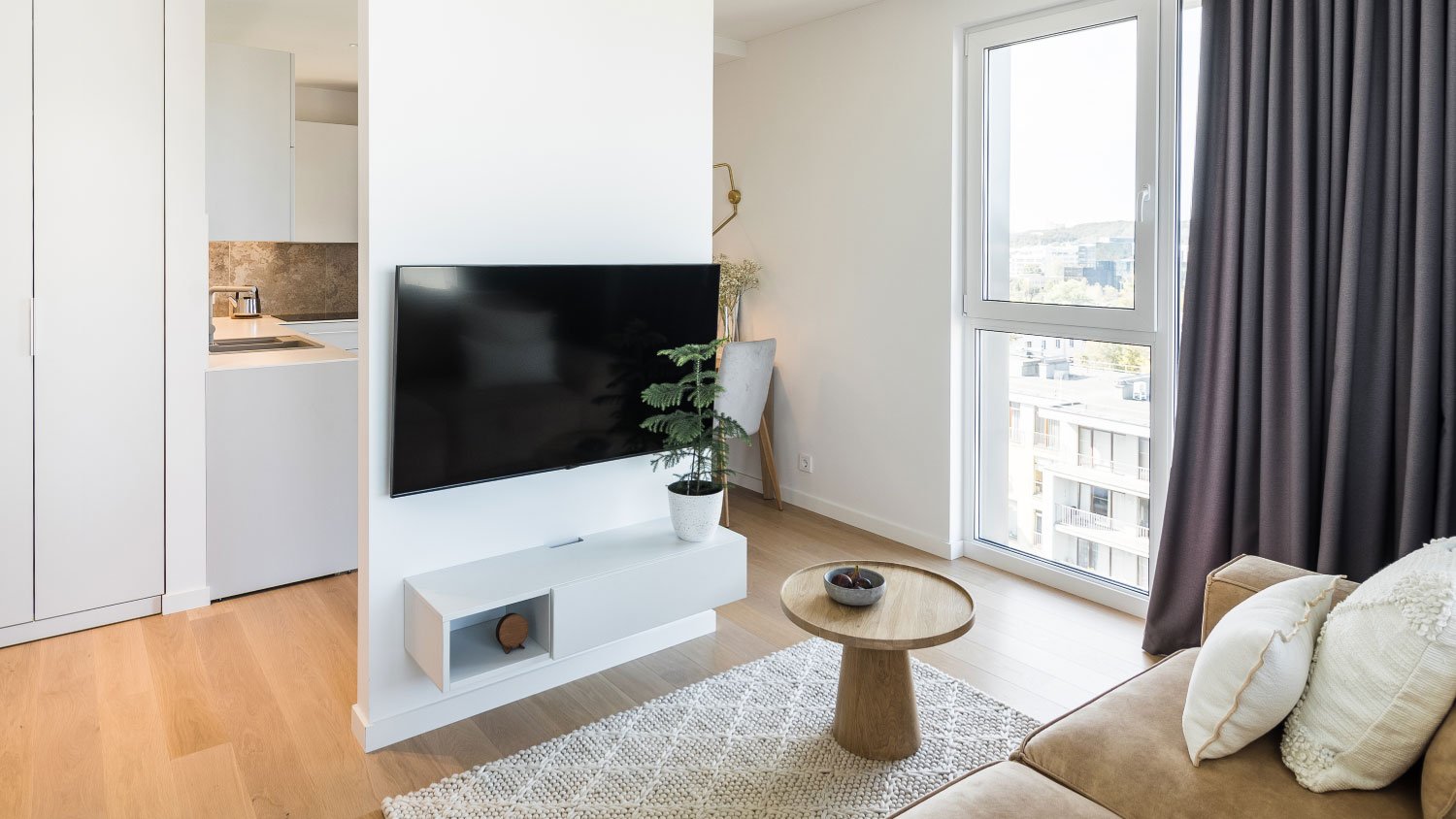 living room with TV and black curtains 