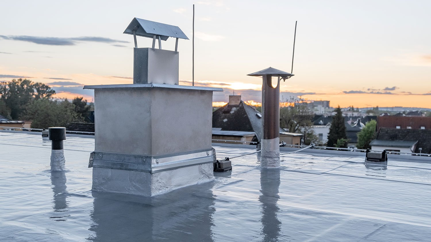 Cement chimney on a flat roof