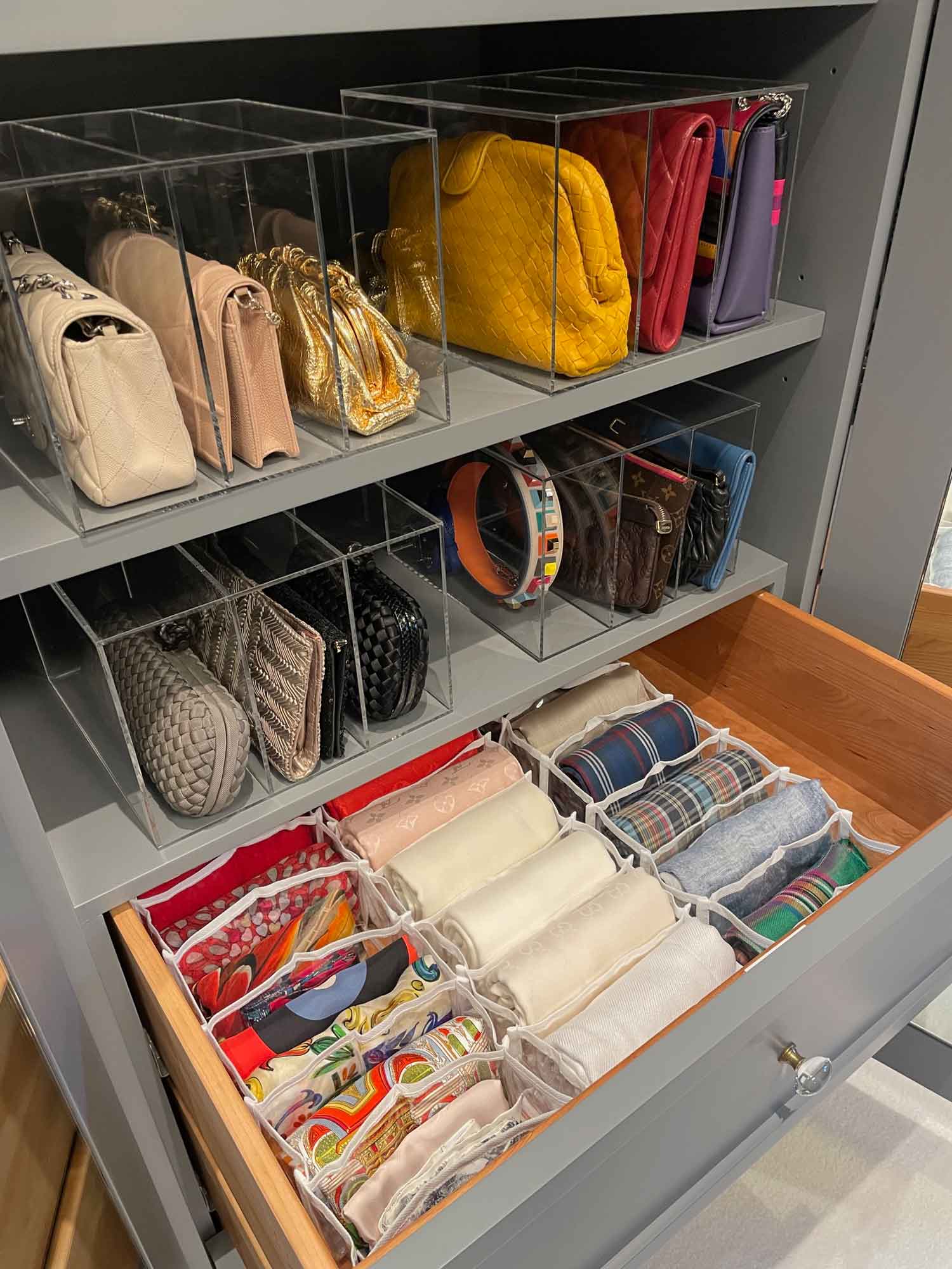 Organized closet interior with open drawer