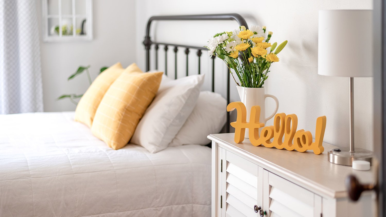 Clean white and yellow bedroom