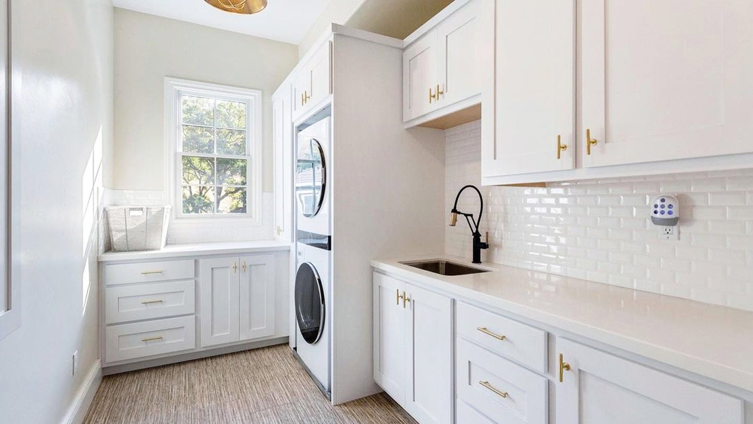 Clean white laundry room title drawers