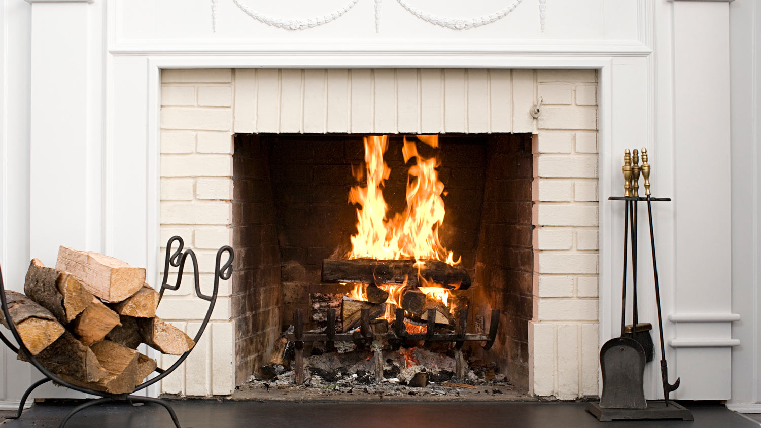 Close-up of a fireplace with a decorated mantel