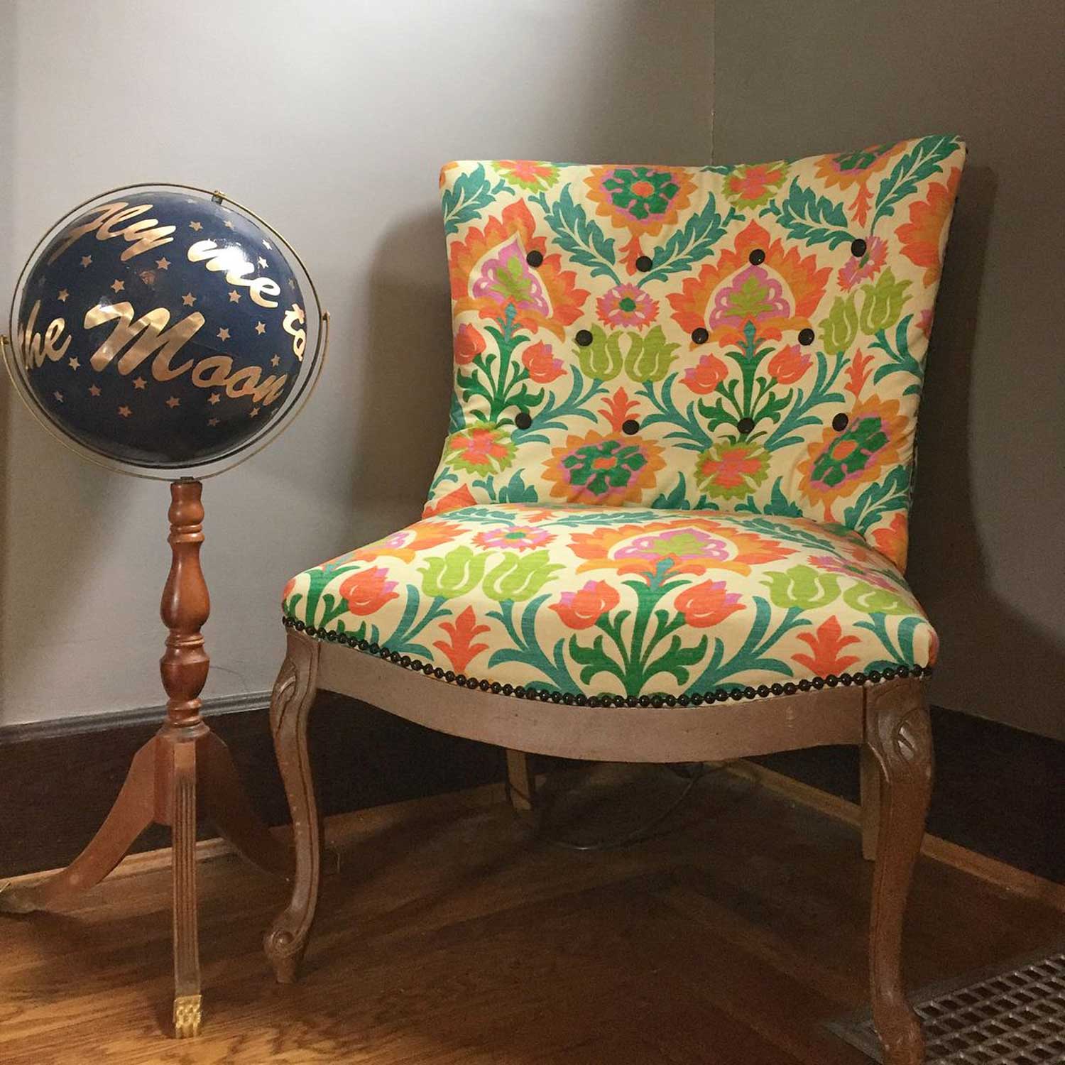 Chair reupholstered with colorful floral fabric