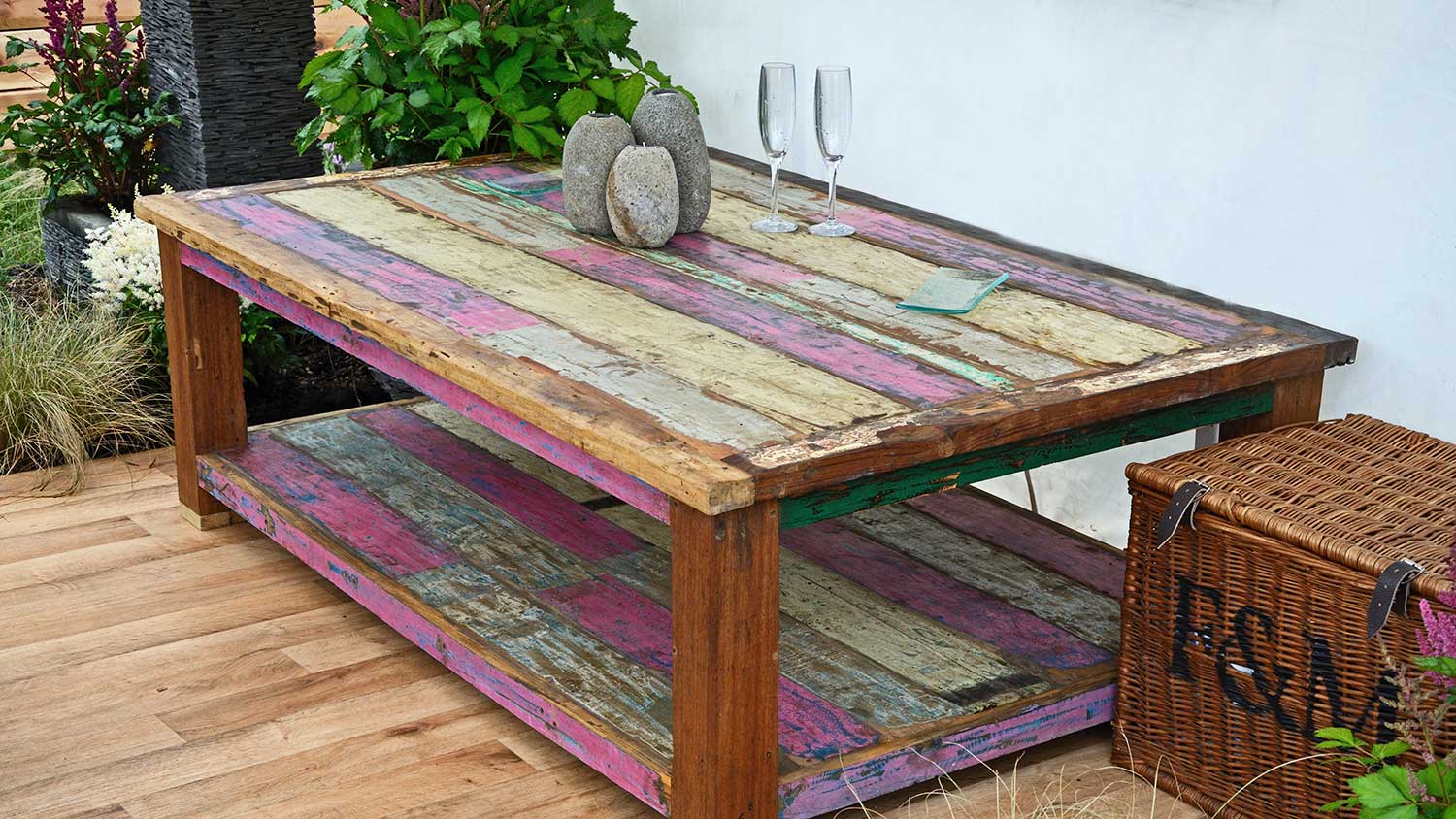 Outdoor wooden table stained with bright colors