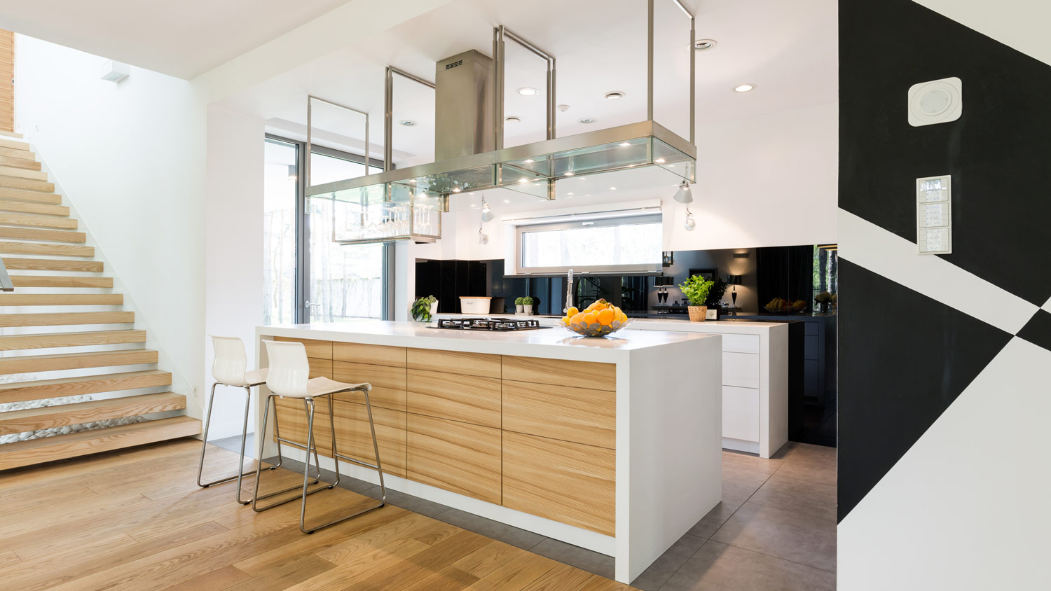 A contemporary kitchen with reclaimed hardwood floor
