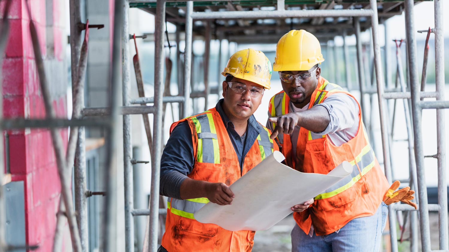A contractor giving direction to a worker
