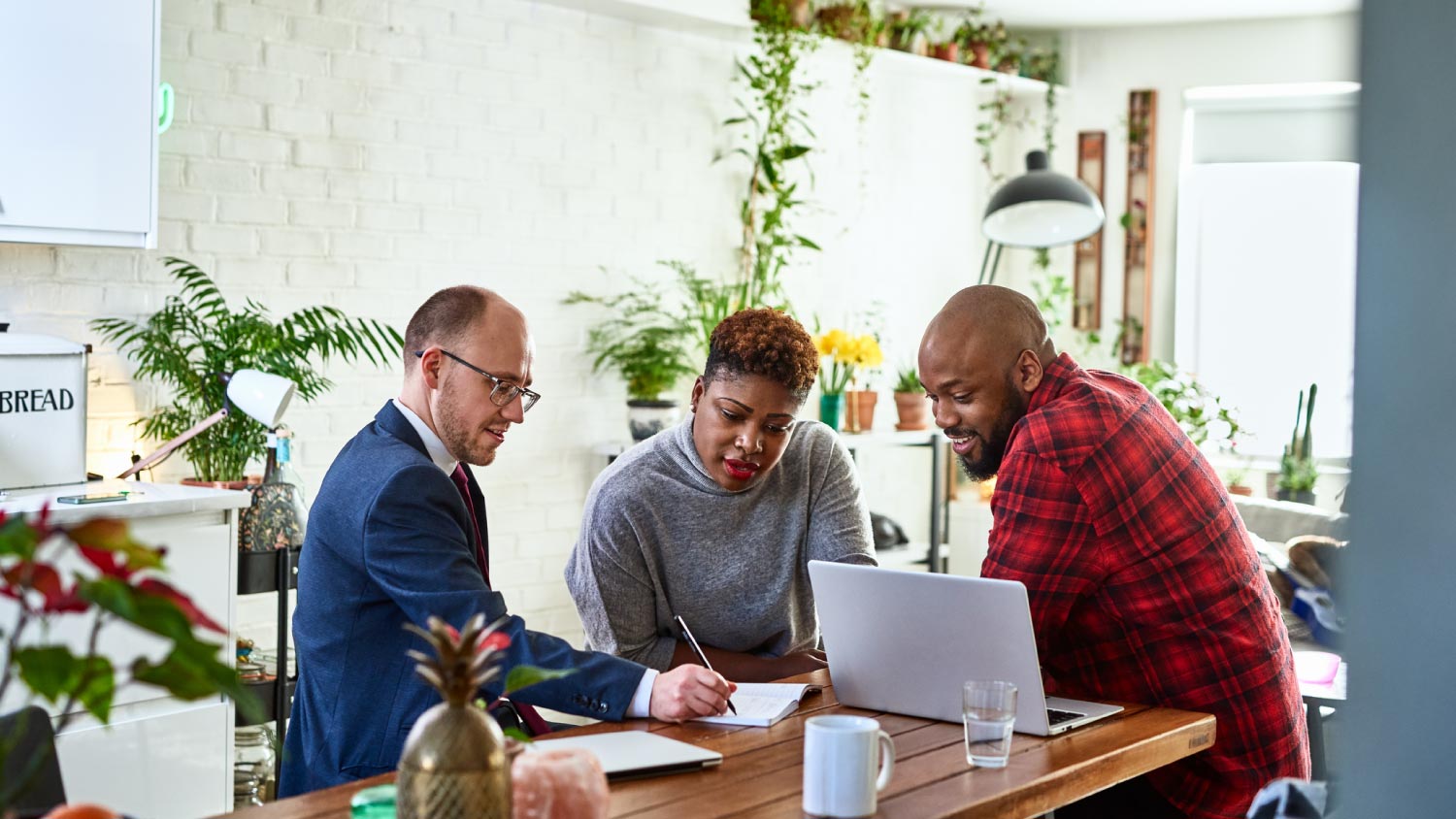 A couple listening to financial advisor at home