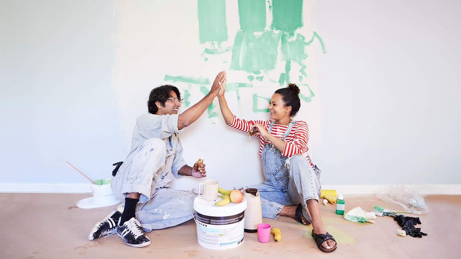 Couple taking a break from painting