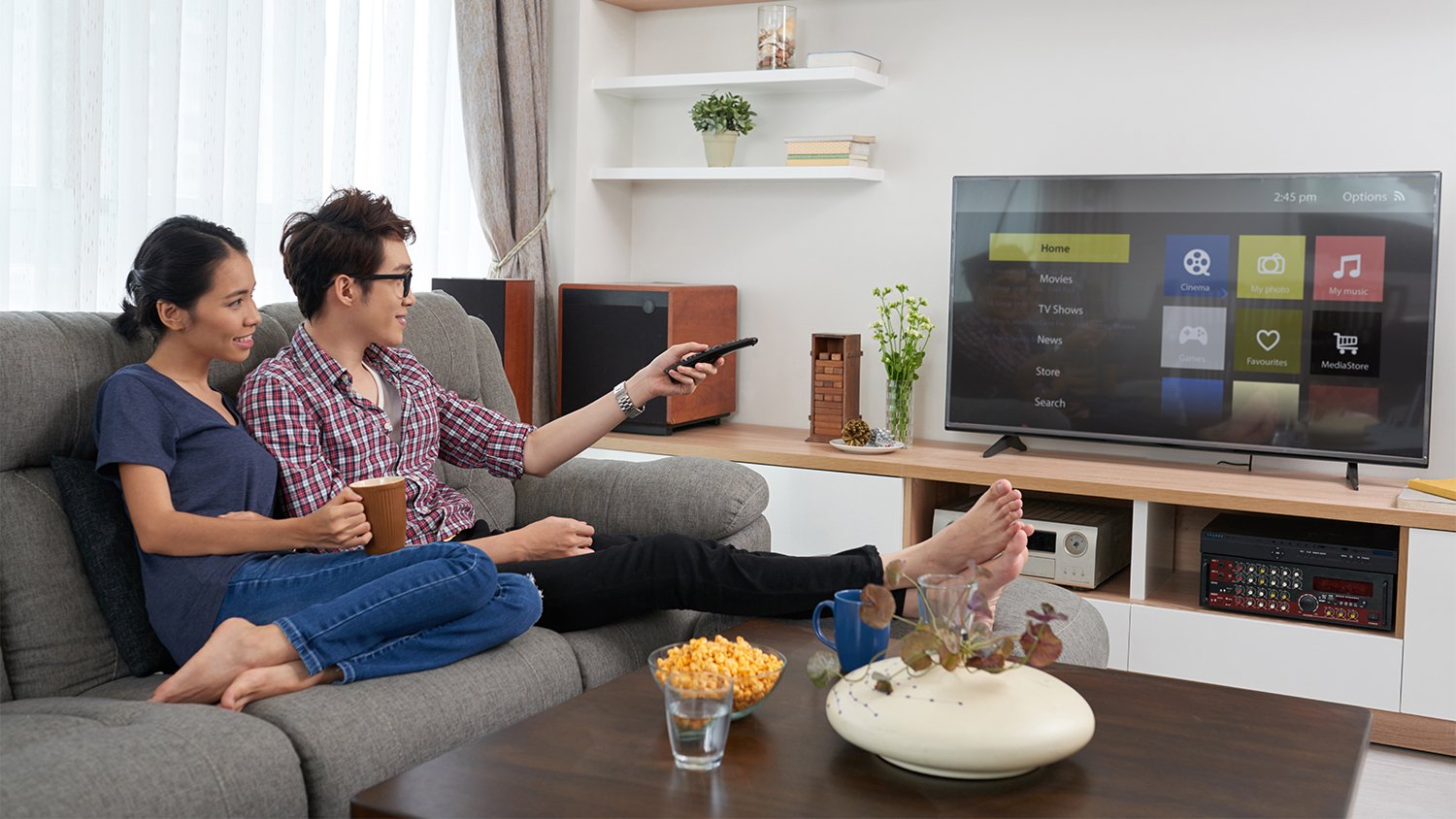 couple on the couch watching tv       