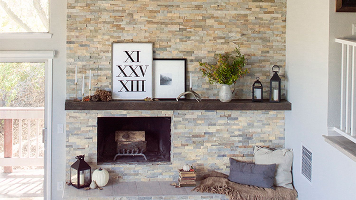 living room with brick fireplace